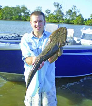 Darren with a flathead that he landed on a recent Pumicestone Passage fishing trip.